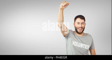 Composite image of portrait of cheerful volunteer Stock Photo