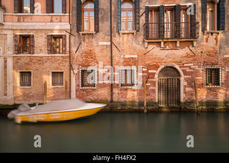 A view of old buildings along the Venetian Canals in the Cannaregio District of Venice. Stock Photo