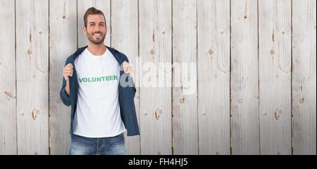 Composite image of portrait of a smiling young male volunteer Stock Photo