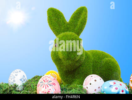 easter bunny with eggs on grass Stock Photo