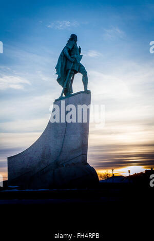 Statue of Leif Eriksen who discovered America outside the Hallgrimskirka Church in Reykjavik, Iceland at sunset in winter Stock Photo