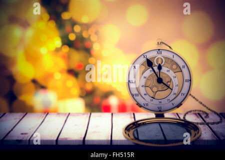 Composite image of close-up of vintage pocket clock with chain Stock Photo