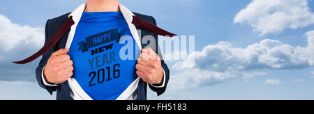 Composite image of businessman opening his shirt superhero style Stock Photo