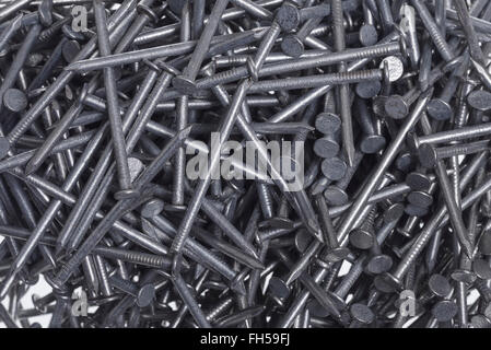Close up detail of a pile of galvanised metal nails Stock Photo