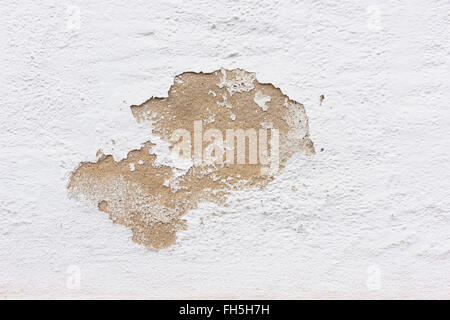 Close-up of paint peeling on exterior stone wall of house, Odenwald, Hesse, Germany Stock Photo