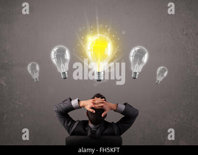 Business person having an idea light bulb concept Stock Photo