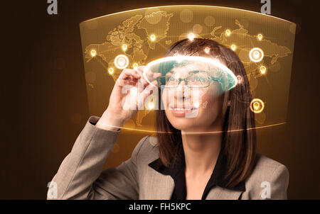 Young woman looking at futuristic social network map Stock Photo