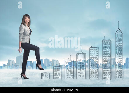 Business woman climbing up on hand drawn buildings in city Stock Photo