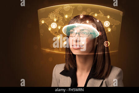 Young woman looking at futuristic social network map Stock Photo