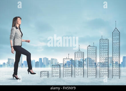 Business woman climbing up on hand drawn buildings in city Stock Photo