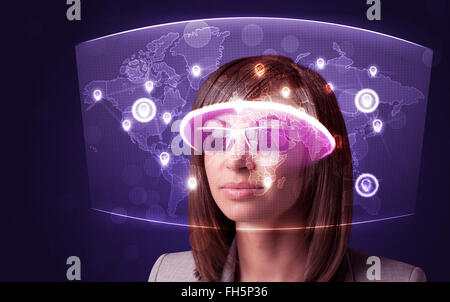 Young woman looking at futuristic social network map Stock Photo