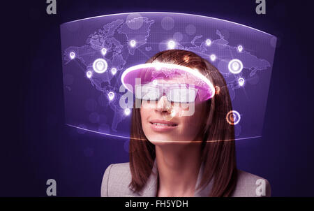 Young woman looking at futuristic social network map Stock Photo