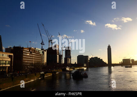 Construction sites and cranes on Albert Embankment next to River Thames, seen from Lambeth Bridge, London, England UK Stock Photo