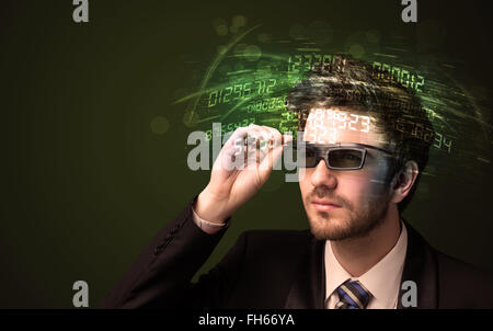 Business man looking at high tech number calculations Stock Photo