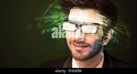 Business man looking at high tech number calculations Stock Photo