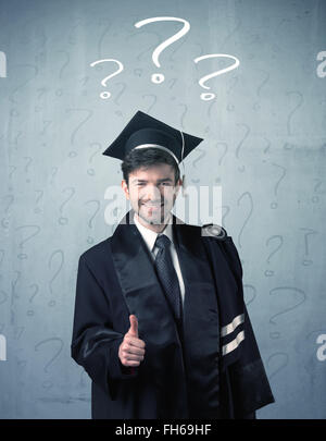 Young graduate teenager with question marks drawn Stock Photo - Alamy