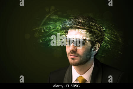 Business man looking at high tech number calculations Stock Photo