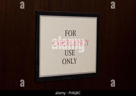 For Emergency Use Only sign on door - USA Stock Photo