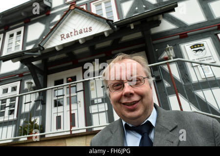 Ottrau, Germany. 10th Feb, 2016. Norbert Miltz, independent mayor of Ottrau pictured outside the timber-framed town hall of Ottrau, Germany, 10 February 2016. PHOTO: UWE ZUCCHI/DPA/Alamy Live News Stock Photo