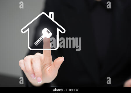 businessman clicks on the icon lodge. key image. The virtual screen Stock Photo