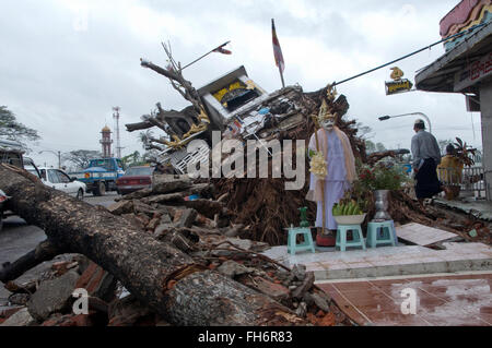 Buddhist statue stands among damage caused by Cyclone Nargis in the city of Yangon, Myanmar on 14 may 2008. Cyclone Nargis caused the worst natural disaster in the recorded history of Myanmar during early May 2008 causing catastrophic destruction and at least 138,000 fatalities. Stock Photo