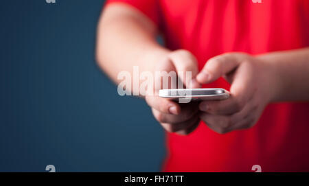 Young man holding smarthphone in hand Stock Photo - Alamy
