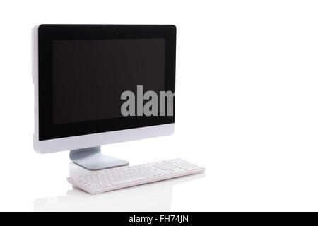 An angle shot of a all in one monoblock personal computer. Modern and stylish. Not apple but looks close to iMac. The screen is  Stock Photo