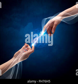 Hands connecting through fingers in space Stock Photo