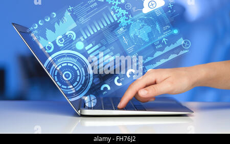 Modern notebook computer with future technology symbols Stock Photo