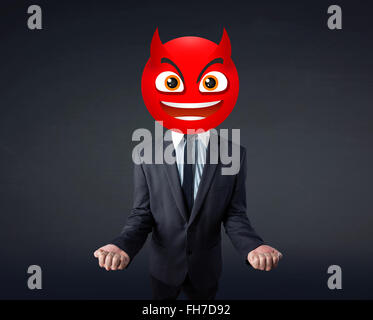 businessman wears devil smiley face Stock Photo