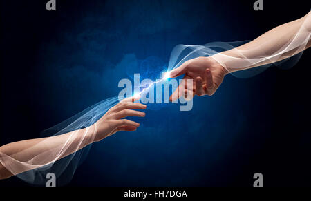 Hands connecting through fingers in space Stock Photo