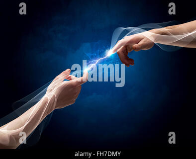 Hands connecting through fingers in space Stock Photo