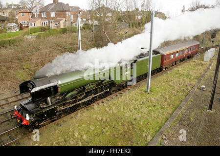 York, UK, 24 February 2016. Newly restored LNER A3 class locomotive “Flying Scotsman” leaves York on its way to London to make its inaugural comeback passenger-hauling journey from London King's Cross to York the following day. The locomotive has been restored at a cost of £4.2 million and in addition to featuring in a new exhibition at the NRM's York location will be hauling special trains throughout the UK in the coming months. Credit:  david soulsby/Alamy Live News Stock Photo