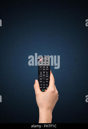 Hand with remote control Stock Photo