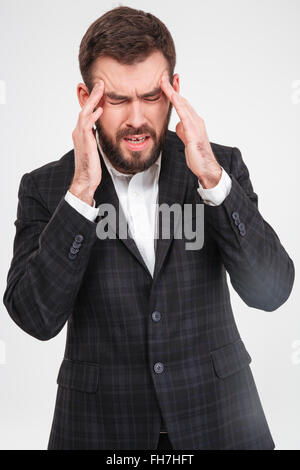 Businessman with headache isolated on a white background Stock Photo