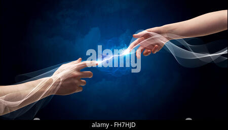 Hands connecting through fingers in space Stock Photo