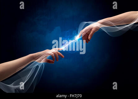 Hands connecting through fingers in space Stock Photo