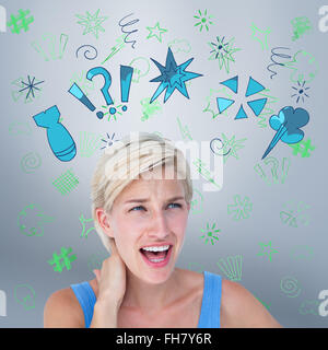 Composite image of woman screaming and suffering from neck pain Stock Photo