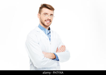 Smiling male doctor in glasses standing with arms folded isolated on a white background Stock Photo