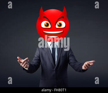 businessman wears devil smiley face Stock Photo