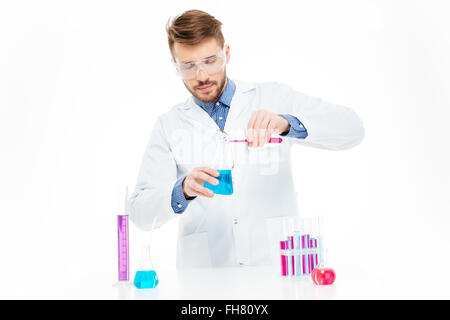 Man pouring chemicals isolated on a white background Stock Photo