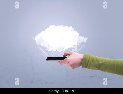 Hand holding phone with empty cloud Stock Photo