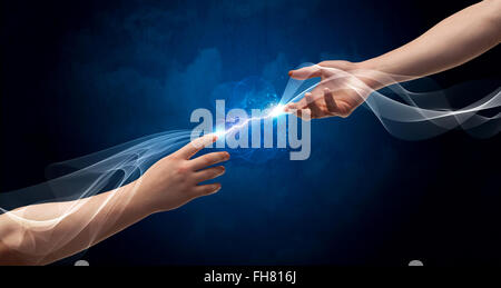 Hands connecting through fingers in space Stock Photo