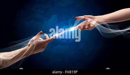 Hands connecting through fingers in space Stock Photo