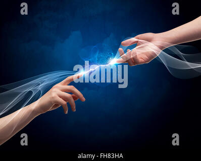 Hands connecting through fingers in space Stock Photo