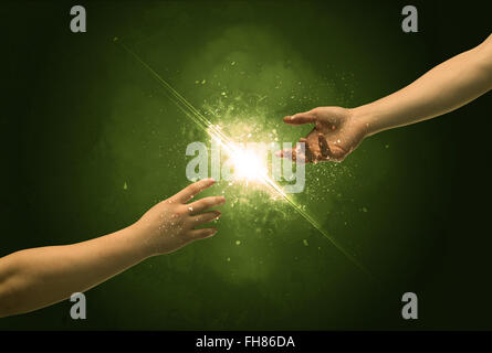 Touching arms lighting spark at fingertip Stock Photo