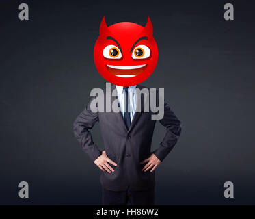 businessman wears devil smiley face Stock Photo