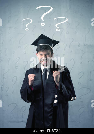 Young graduate teenager with question marks drawn Stock Photo - Alamy