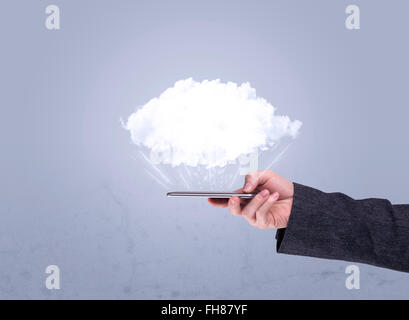 Hand holding phone with empty cloud Stock Photo