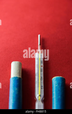 Medical mercury thermometer in old box Stock Photo